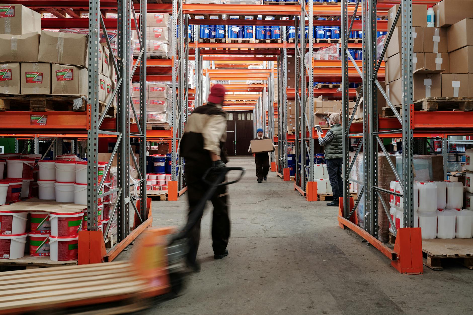 photo of men working in a warehouse