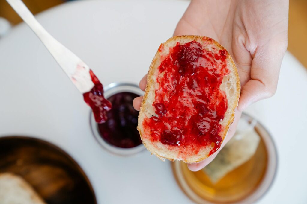 close up shot of a delicious bread with strawberry jam