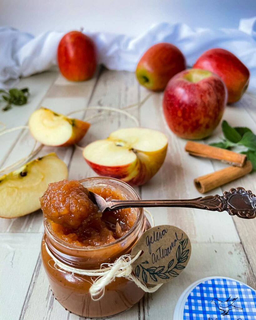 a close up shot of a jar of apple jam